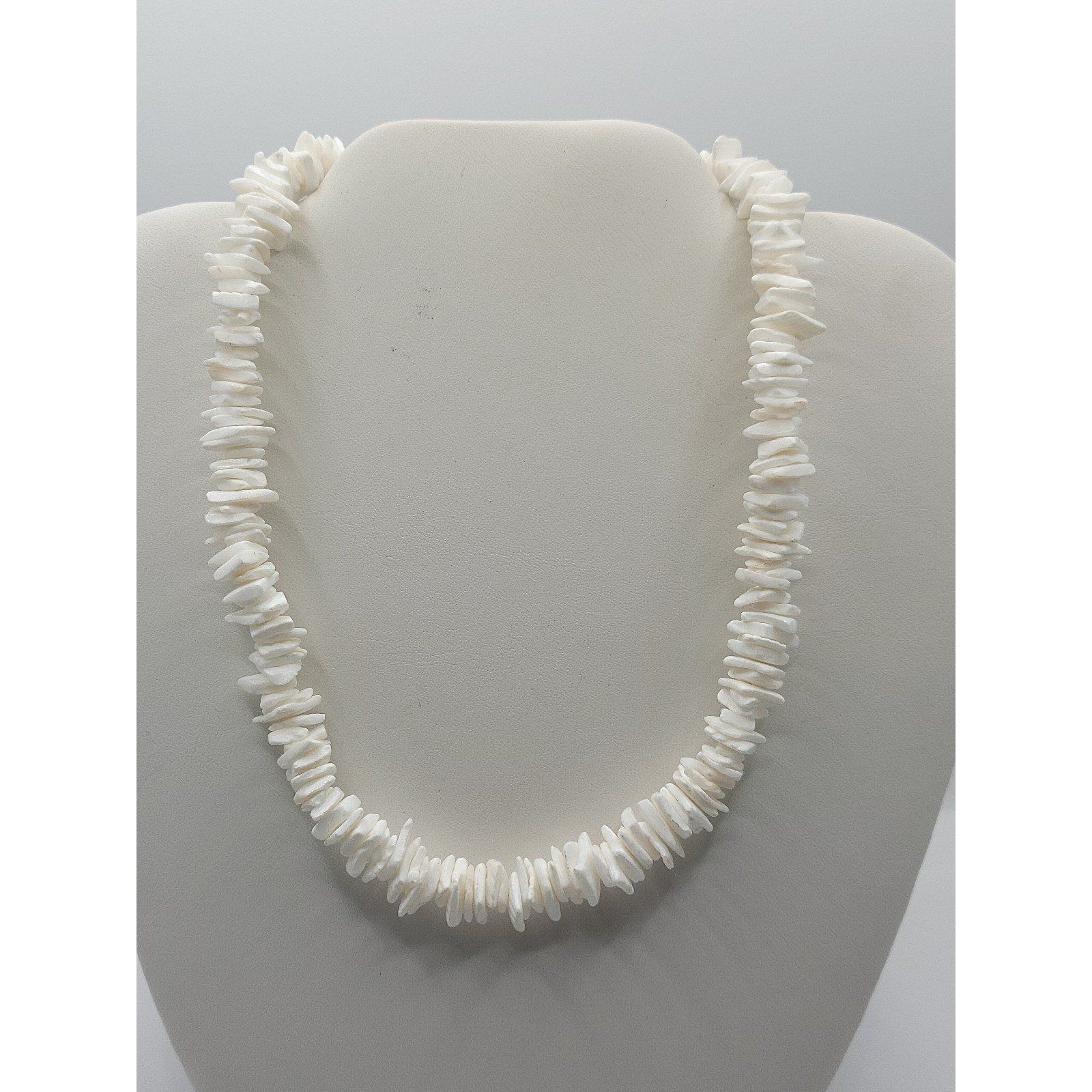 Necklace of light white flat shell chips with clean drilled centre holes, the common modern puka shell substitute